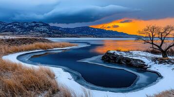 Stunning Winter Sunset over Frozen Lake and Mountains Scenic Landscape Photography photo