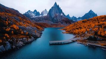 Stunning Aerial View of Alpine Lake Mountains and Autumnal Foliage photo