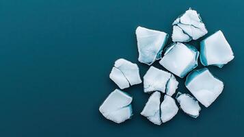Abstract Teal Background with Broken Ice Cubes Cool Winter Texture Frozen Fragments photo