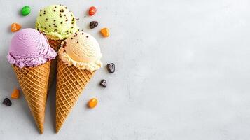 Delicious Triple Scoop Ice Cream Cones with Colorful Candies on White Background photo
