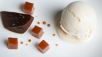 Gourmet Vanilla Ice Cream with Salted Caramel Cubes Sauce Dessert photo