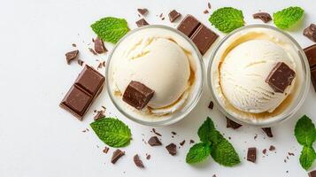 Delicious Vanilla Ice Cream Scoops with Chocolate and Mint Garnish photo