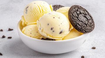 Creamy Vanilla Ice Cream Scoops with Chocolate Cookies in Bowl photo