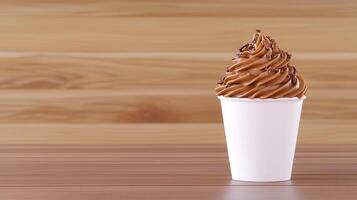 Delicious Chocolate Frozen Yogurt in a Cup on Wooden Table photo