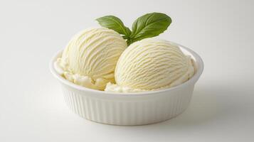 Creamy Vanilla Ice Cream Scoops in White Bowl Garnish with Basil photo