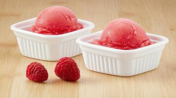 Delicious Raspberry Sorbet in White Bowls with Fresh Raspberries on Wooden Surface photo