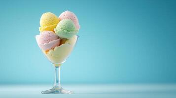 Delicious Pastel Ice Cream Scoops in Glass Bowl on Blue Background photo