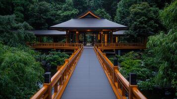 Serene Japanese Garden Pavilion with Wooden Bridge and Lush Greenery photo