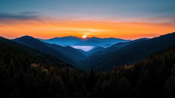 Majestic Sunrise Over Misty Mountain Ranges and Evergreen Forests photo