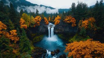 Majestic Waterfall Cascading Through Autumnal Forest Aerial View photo