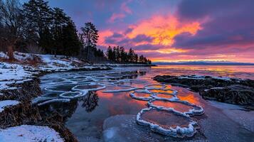Stunning Winter Sunset Landscape Frozen Ice Circles on a Lake Shore photo