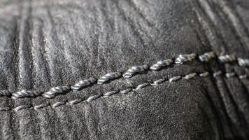 black crinkle leather with light threads photo