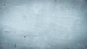 a wall with a visible plaster texture painted blue photo