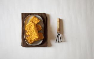 Rusks with a small garden fork minimal flat lay photo