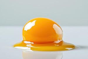 Raw egg yolk on a glossy surface showcasing modern food artistry in minimalist design photo