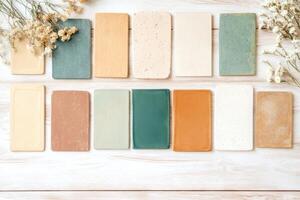 Create a harmonious earthy-toned mood board with natural textures and vintage tiles on a rustic wooden table for design inspiration photo
