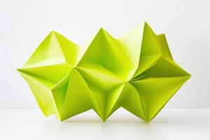 Abstract folded neon yellow paper shape showcasing modern geometric design on a white surface in a minimalist setting photo