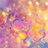 Numerous transparent bubbles of varying sizes rise in a liquid, illuminated by vibrant colors. The background blends warm and cool tones, creating a fluid and dynamic composition photo