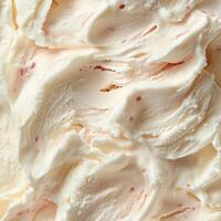 Peach ice cream with red strawberry pieces, creating a perfect balance of creamy and fruity textures. The pastel orange base contrasts beautifully with vibrant red berry bits photo
