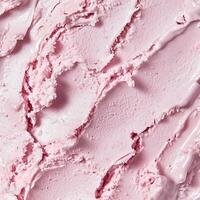 Soft pink ice cream texture with delicate ridges and creamy consistency. The surface appears freshly scooped, showcasing a smooth yet slightly airy structure photo