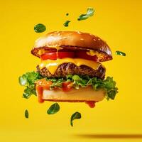 Juicy cheeseburger with lettuce, tomato, and dripping sauce on a yellow background. Floating ingredients add a dynamic effect. Perfect for fast food, restaurant, and menu designs photo