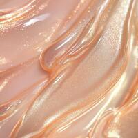 A pearlescent pink liquid highlighter swatch with a soft, shimmering finish. The silky texture reflects light beautifully, creating a dewy, luminous effect with fine iridescent particles photo