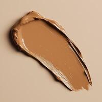 A warm chestnut foundation smear with a velvety texture and seamless application. The rich, buttery consistency enhances the products natural finish, blending effortlessly into the skin photo