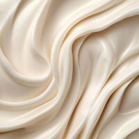 A soft, white creamy surface with smooth, flowing zigzag patterns. Glossy highlights enhance the silky texture, creating a sense of fluidity and elegance. Gentle curves add depth and movement photo