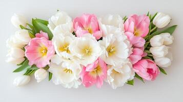 Elegant bouquet of pink and white tulips arranged beautifully on a clean background photo