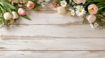 Vibrant pastel tulips and fresh flowers arranged on rustic wooden planks for spring decor photo