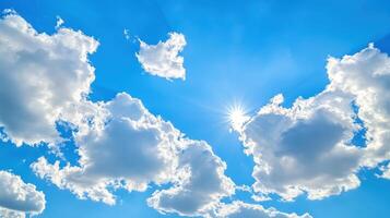 Vibrant blue sky filled with fluffy clouds during a sunny afternoon photo