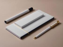 A white and gold pen lays on top of a white notebook photo