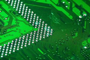 Green circuit board of a computer close up photo