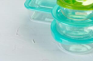 Set of plastic boxes kitchen ware on kitchen counter photo