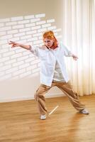Dancer showcases expressive movement in a sunlit studio during a dynamic practice session photo