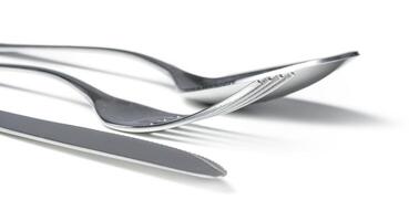 Spoon, knife and fork isolated on white background photo