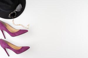 Female fashion accessories on white background, view from above photo
