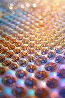 Brightly colored honeycomb pattern reflects light in an artistic display showcasing details and textures photo