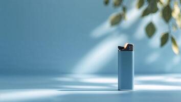 Lighter resting on a smooth surface with soft light and gentle shadows in a tranquil indoor setting photo