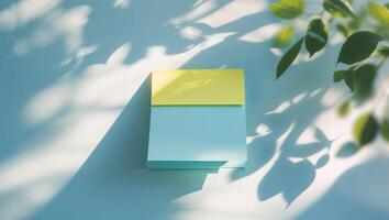 Colorful sticky notes on a wall with natural light and shadow during a bright day photo