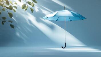 Blue umbrella stands out under soft light with subtle shadows and greenery in a tranquil setting photo
