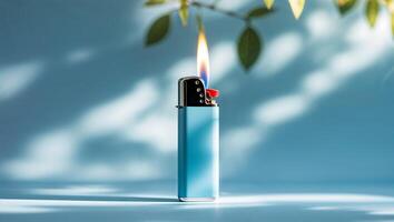 Bright blue lighter with flame illuminated by sunlight in a serene setting photo