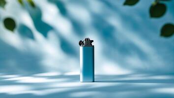 Lighter resting on a textured surface with softly blurred leaves in the background during daylight photo