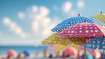 Colorful beach umbrellas provide shade and vibrancy on a sunny day by the ocean photo
