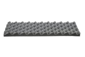 Isolated on a white background, this gray acoustic foam panel features an egg crate pattern for soundproofing. photo
