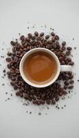 Coffee Cup with Coffee Beans on White Background and Copy Space vertical above photo