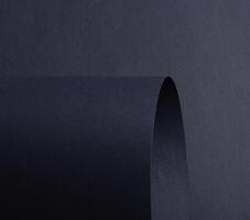 Navy, blue, and midnight indigo paper with smooth texture. Deep, rich folded curves create an photo