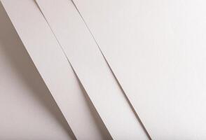 Pearl, off-white, and beige paper with metallic shimmer and smooth texture. Layered, folded design photo