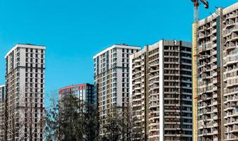 Modern high-rise condominium in metropolitan downtown. Concrete structure with large windows photo