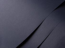 Blue, navy, and deep blue paper with subtle grain texture. Smooth, matte finish and layered folds photo